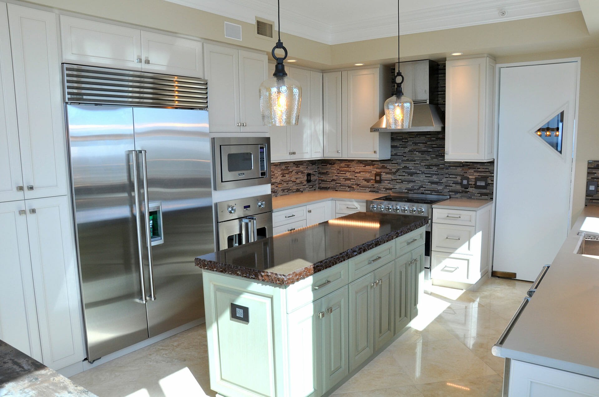 Traditional kitchen remodel with white cabinetry and a contrasting island in the Fort Lauderdale area
