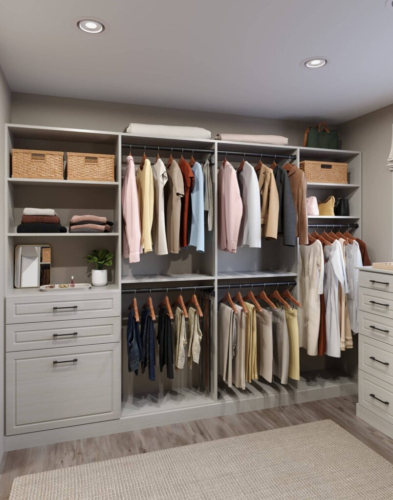 Organized closet with clothes and storage baskets.