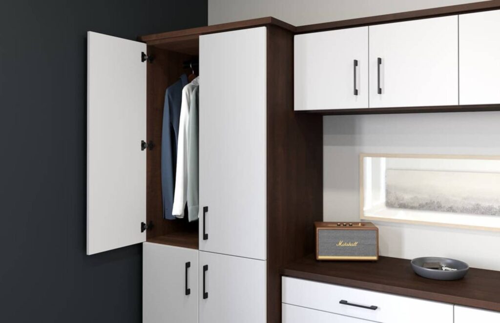 White wardrobe with clothes and shelf with speaker