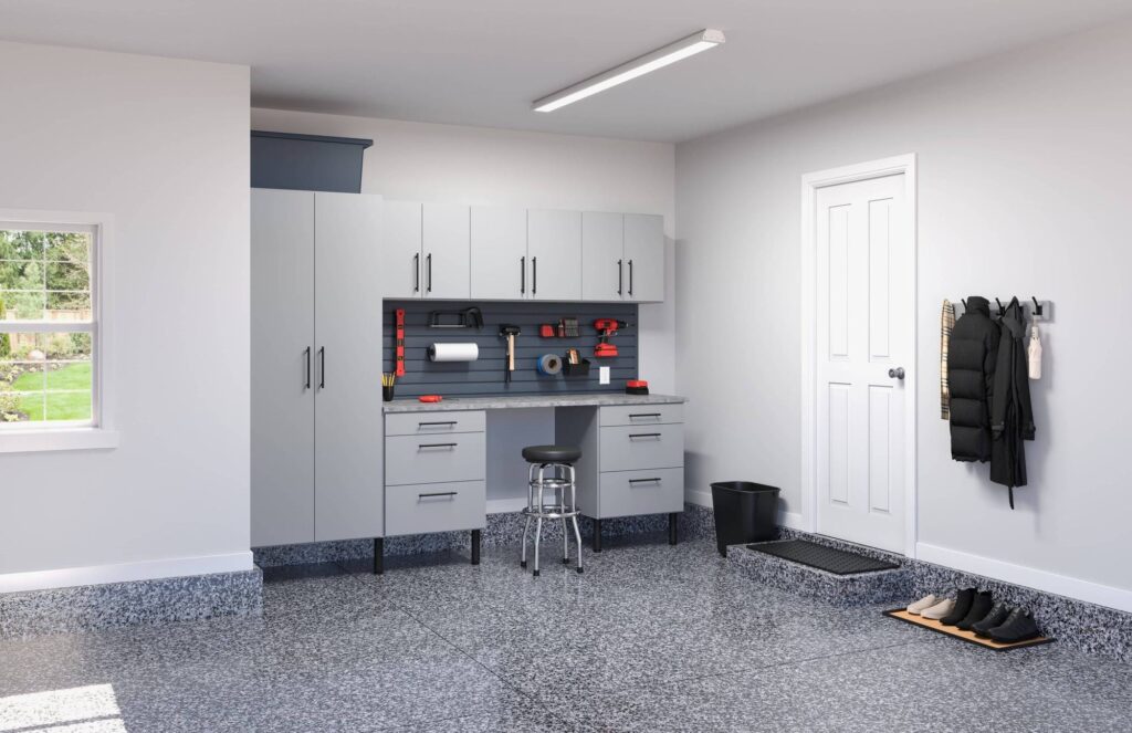 Organized garage with cabinets and workbench.