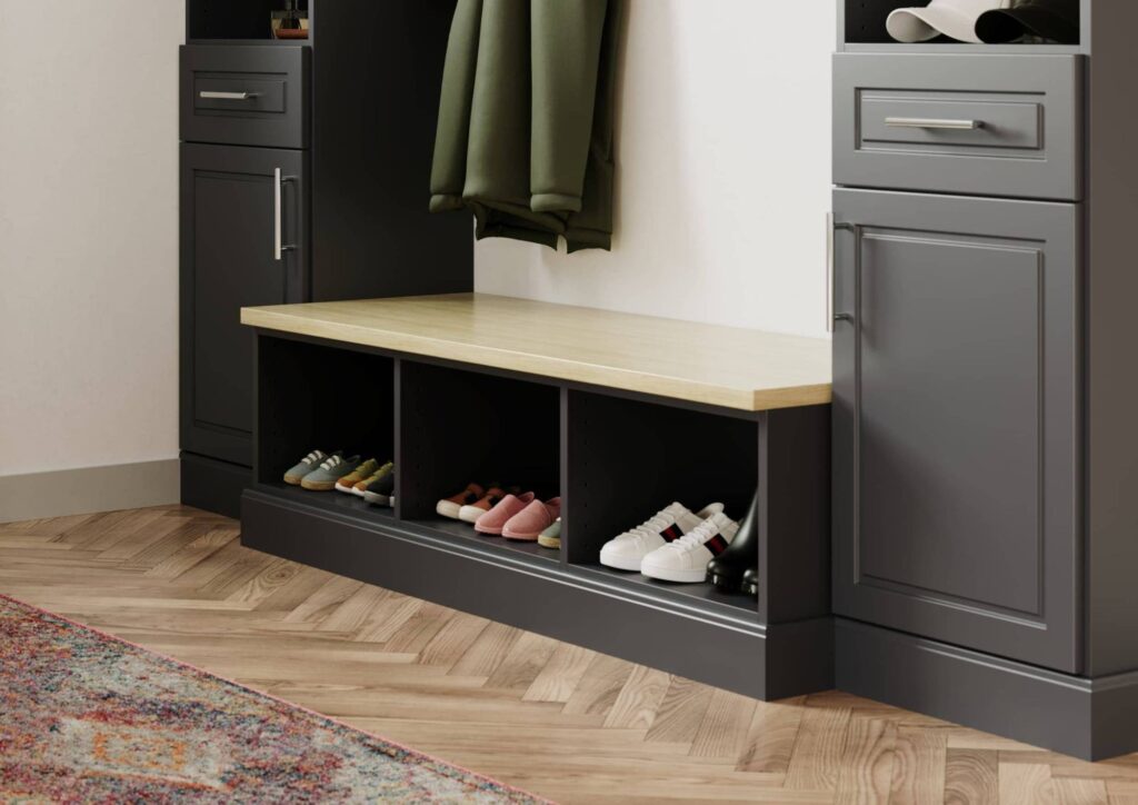 Entryway bench with shoe storage and cabinets.