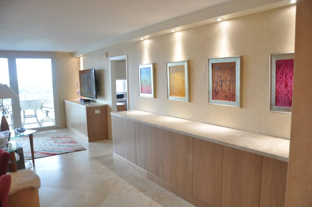 Modern living room with colorful framed artwork.