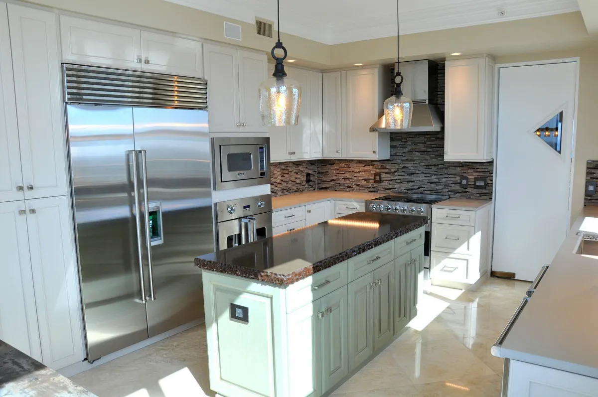 Traditional kitchen remodel with white cabinetry and a contrasting island in the Fort Lauderdale area