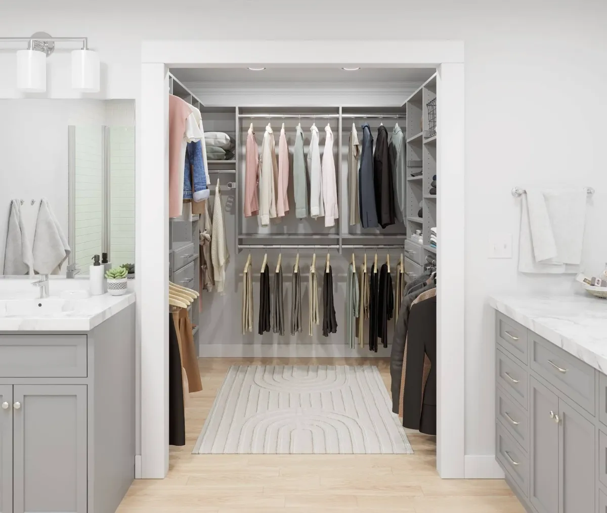 Gray reach-in closet with double hanging rods, drawers, side shelving, and recessed lighting