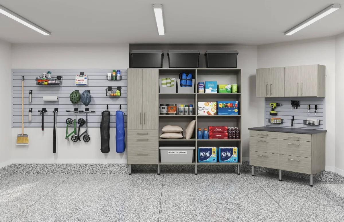 Garage with slatwall storage, tall cabinets and open shelving